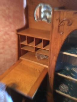 Oak secretary cabinet with oval glass front display