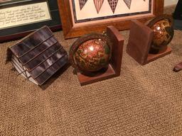 Matted and framed eagle/mountain scenery, a lidded glass bird house, book ends, and weaved basked.