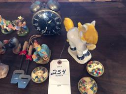 Vintage alarm clock, varied animal figurines, and more.