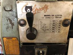 Grizzly 12'' x 37'' metal lathe, model DF-1237G, has 3 & 4 jaw chucks & faceplate - includes taper