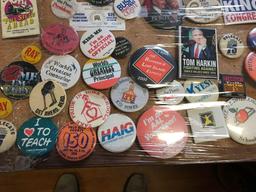Corkboard of political pins and cigar box of Bedel Congress political pins....