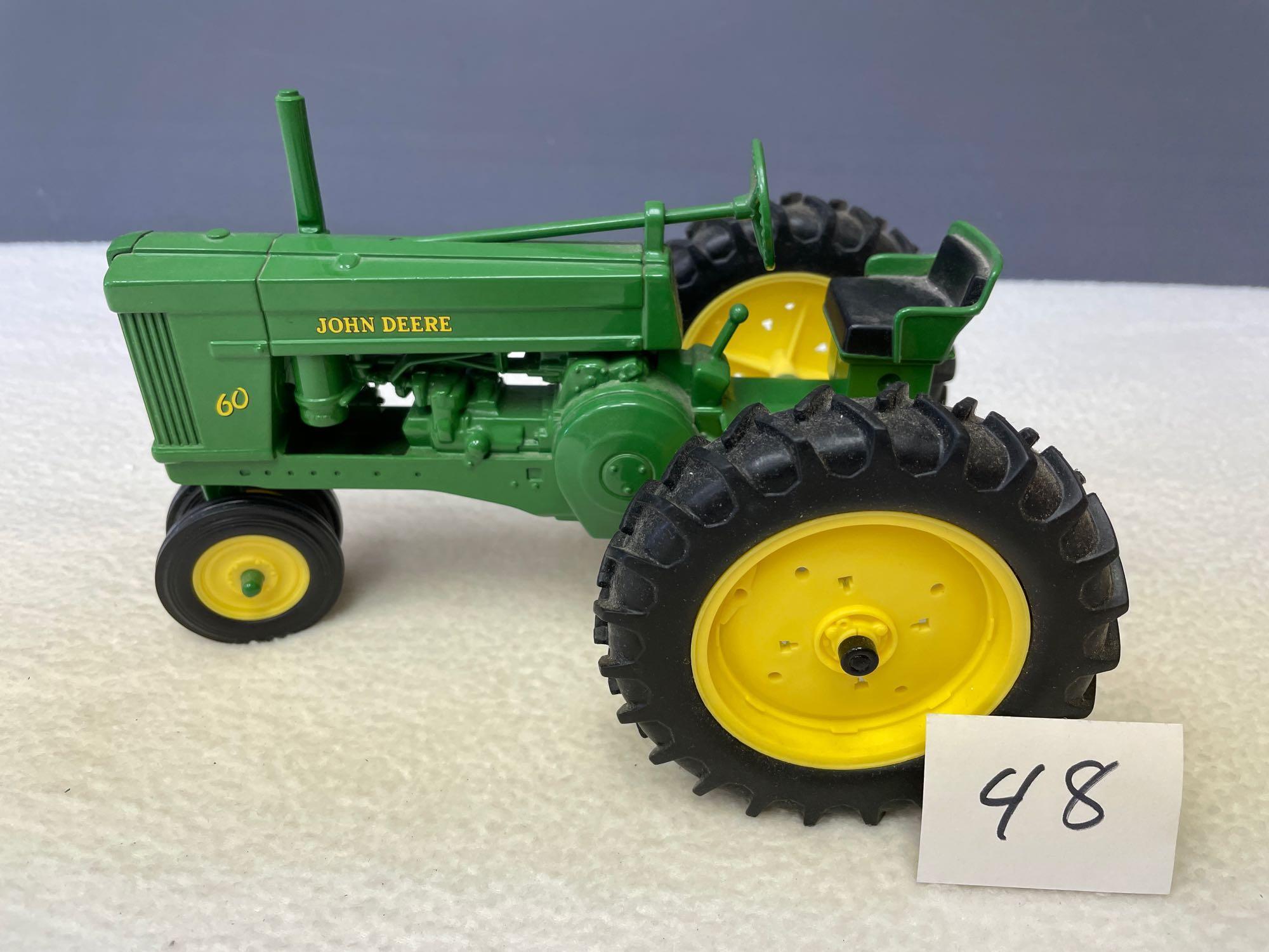 New (no box) 1/16th scale, Die Cast JD #60 tractor, NF.