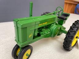 New (no box) 1/16th scale, Die Cast JD #60 tractor, NF.