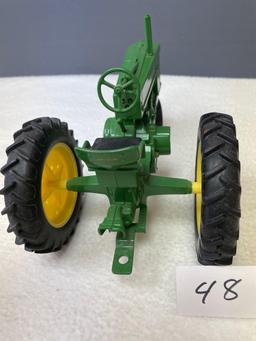 New (no box) 1/16th scale, Die Cast JD #60 tractor, NF.