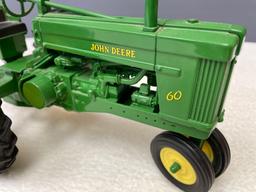 New (no box) 1/16th scale, Die Cast JD #60 tractor, NF.