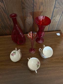 Desk lamp, cups and ruby red vases.