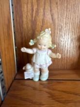 4 Enesco porcelain figurines. Shipping