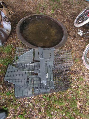 lot of 4 animal live traps and a fire pit