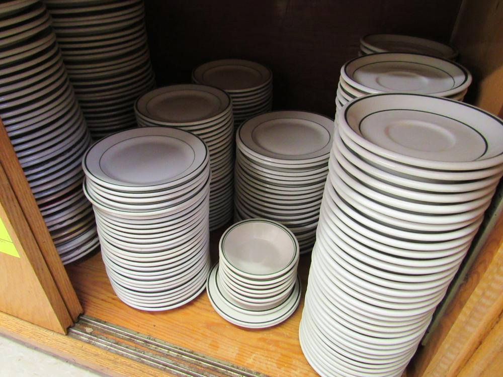 plates and saucers in cabinet
