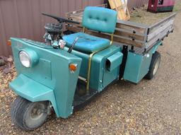 Cushman 3-wheeled scooter w/ diamond plate lift bed