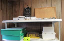 items on the top 2 shelves, muffler clamps, o-rings