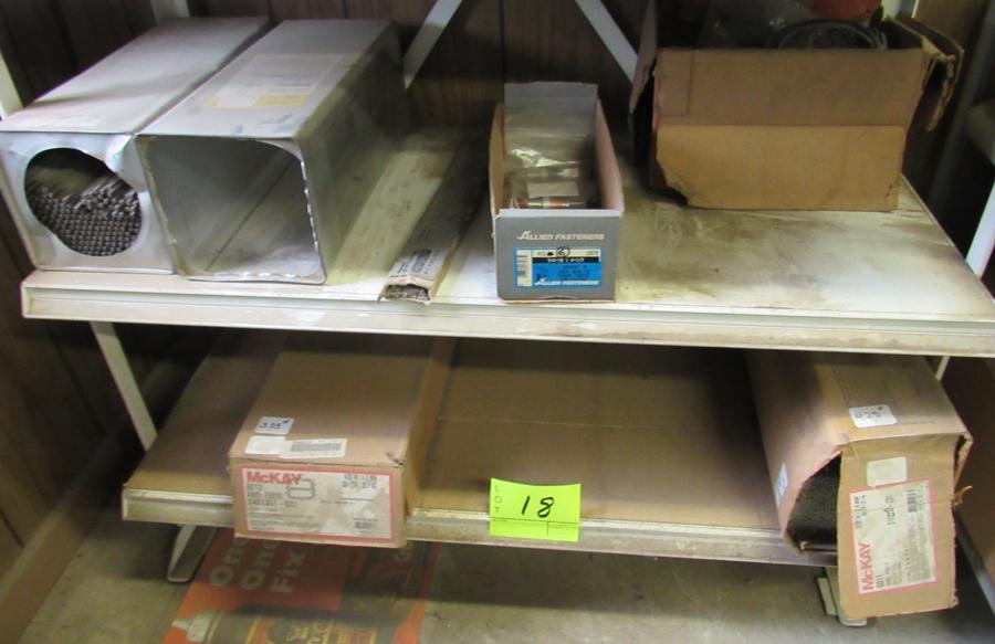 items on the bottom 2 shelves, welding rods, misc