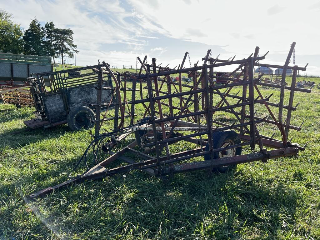 Spiked tooth harrow on cart