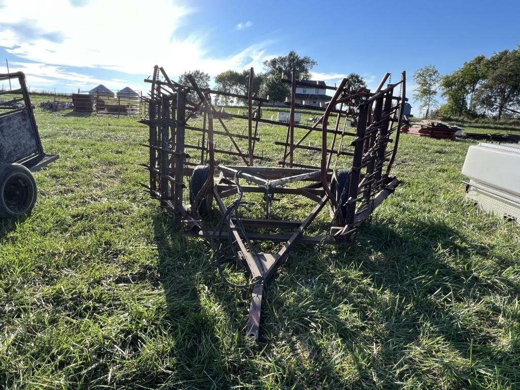 Spiked tooth harrow on cart