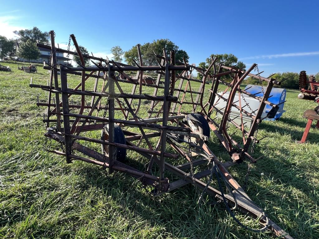 Spiked tooth harrow on cart