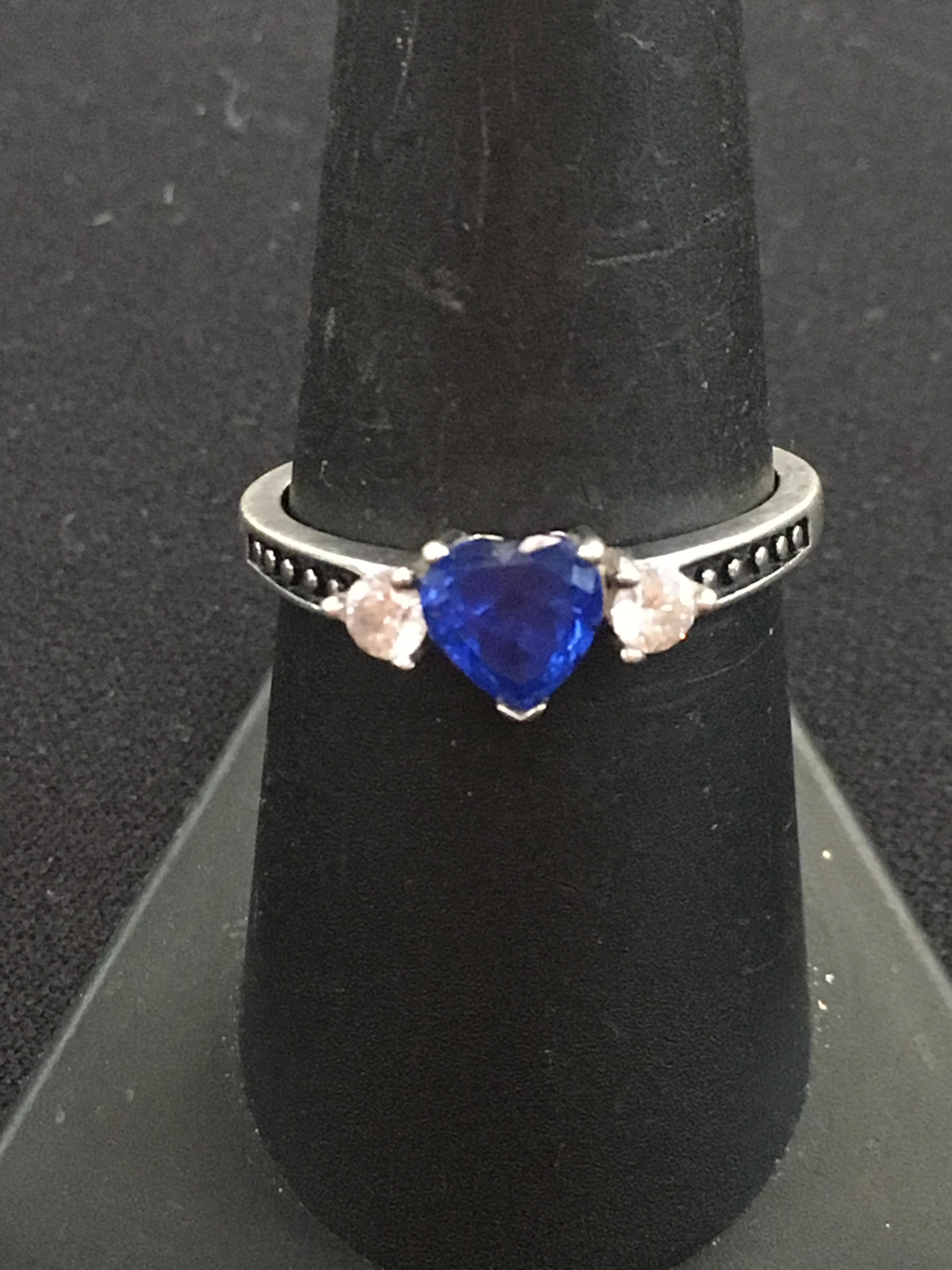 Brilliant Blue Heart Gemstone Flanked by White Gemstones in Sterling Silver Ring - Size 8