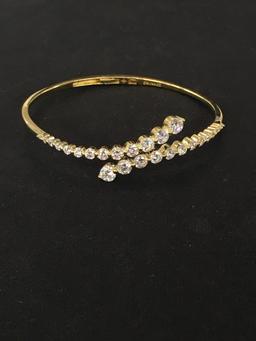 Gold-Tone Spring Bypass Sterling Silver Bangle Bracelet Adorned w/ Graduating Rhinestones