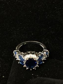 Oval Faceted 9x7mm Created Blue Sapphire Center w/ White Zircon Halo & Marquise Sapphire Sides