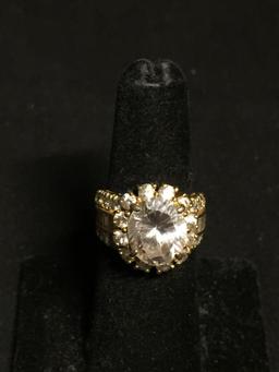 Oval Faceted 12x10mm CZ Center w/ Round CZ Halo & Baguette Accented Shoulders Gold-Tone Signed