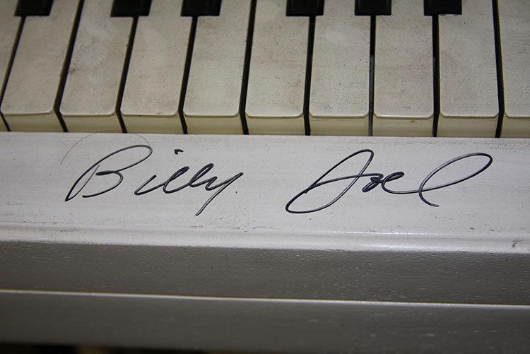 White Piano Signed by Billy Joel