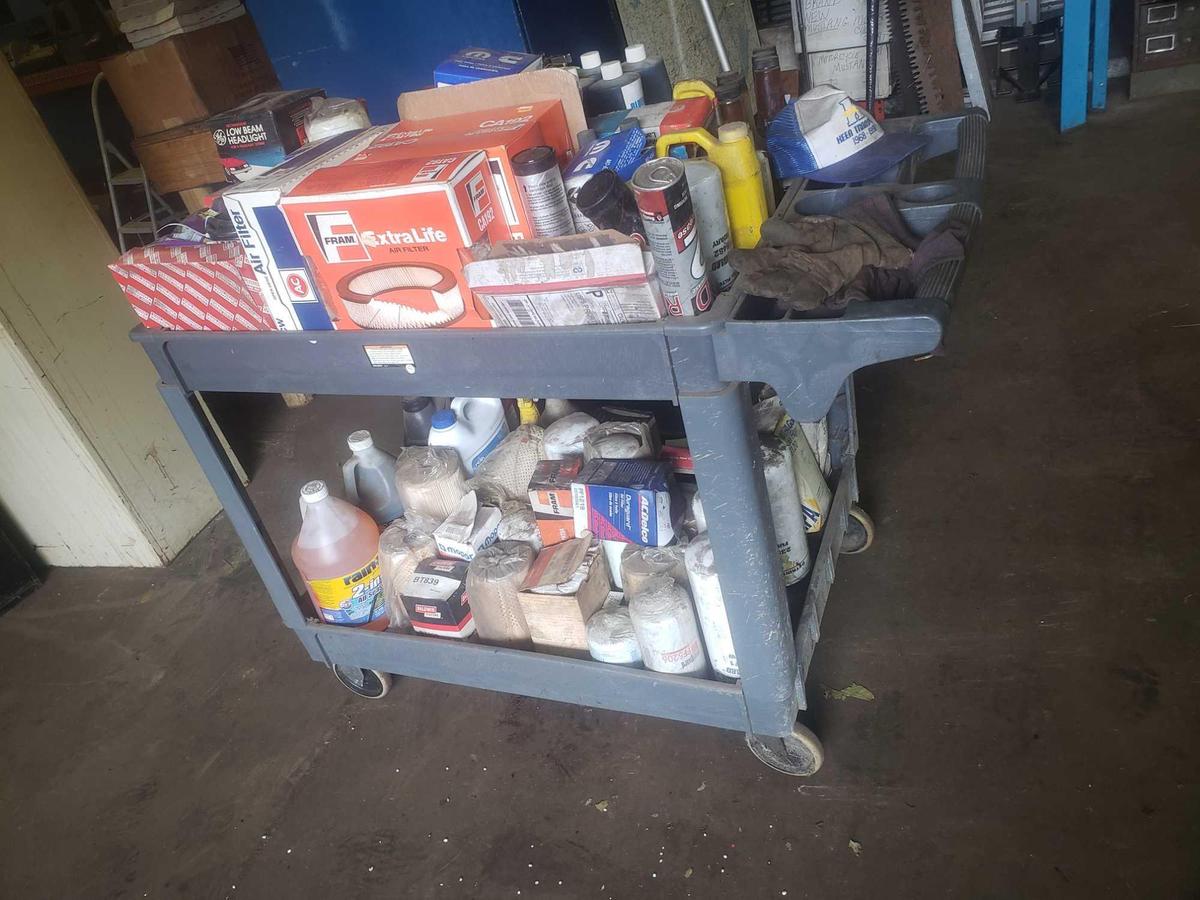 Cart loaded with filters, oil, grease, and more