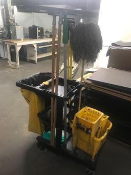 Rubbermaid janitor cart with assorted cleaning supplies and mop bucket