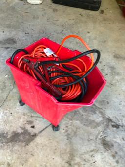 Jumper Cables, Extension Cord, Red Bucket and Tire Pressure Gauge