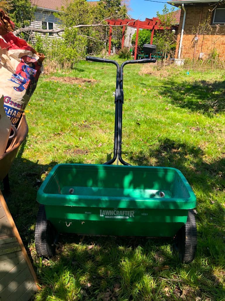 Wheelbarrow, hose wheel cart and other random yard items
