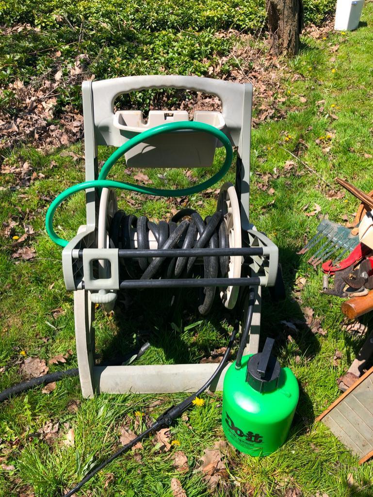 Wheelbarrow, hose wheel cart and other random yard items