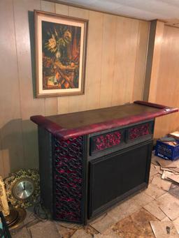 Retro bar with red velvet accents and vintage stereo components