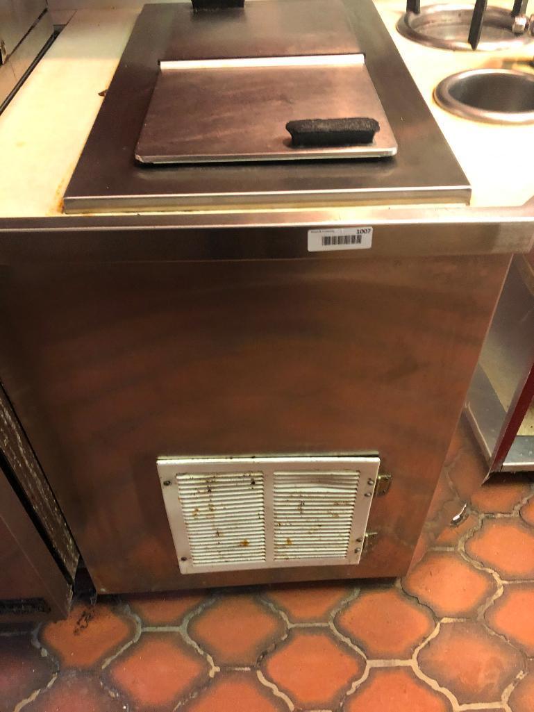 Ice Cream line with shelves and fixtures above.