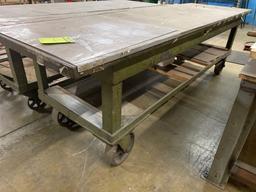 Large metal table in heavy duty casters