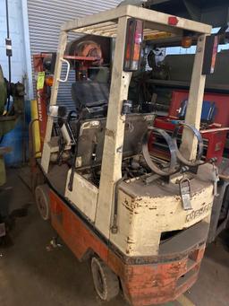 Nissan model CPH01A15V 3000 pound double mast forklift