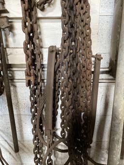 Wall of assorted chains, hooks and cables. See pics