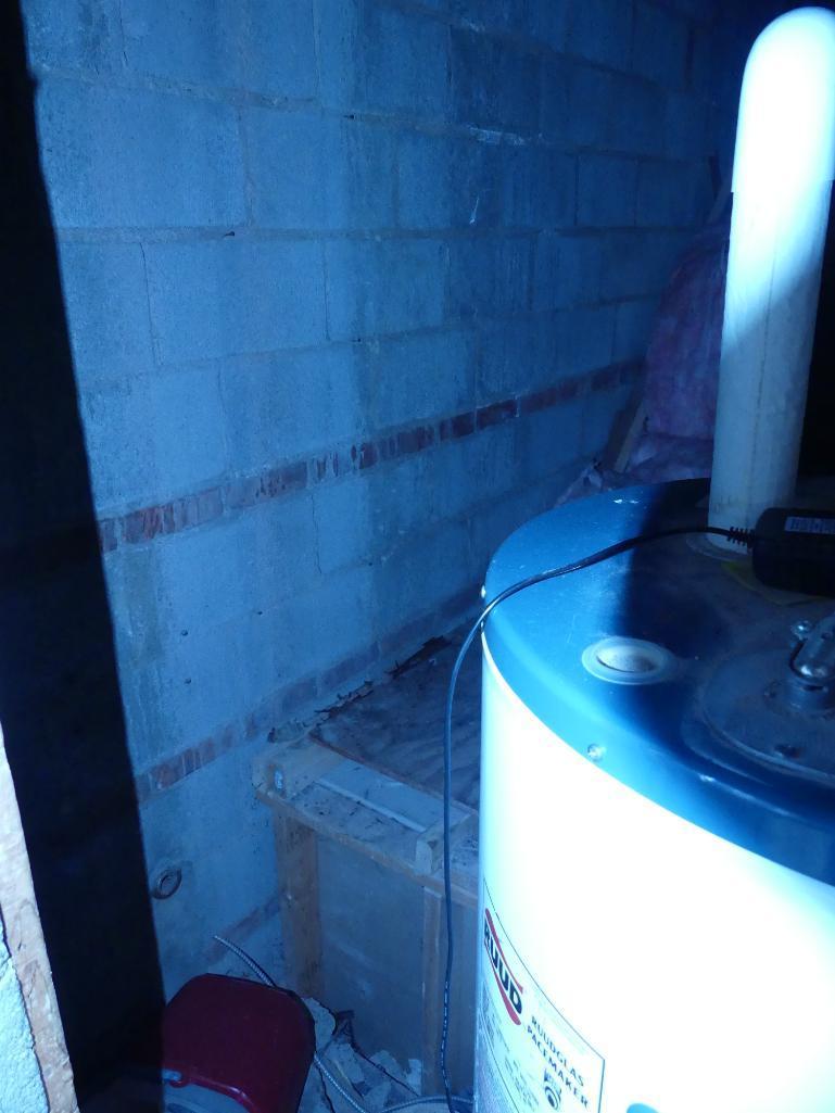 Contents of Broom Closet Including Water Heater