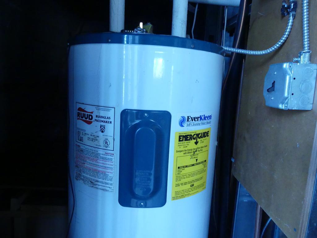 Contents of Broom Closet Including Water Heater