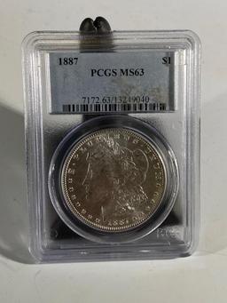 1887 Morgan Silver Dollar, graded MS63 by PCGS