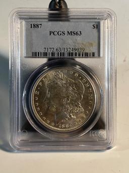 1887 Morgan Silver Dollar, graded MS63 by PCGS