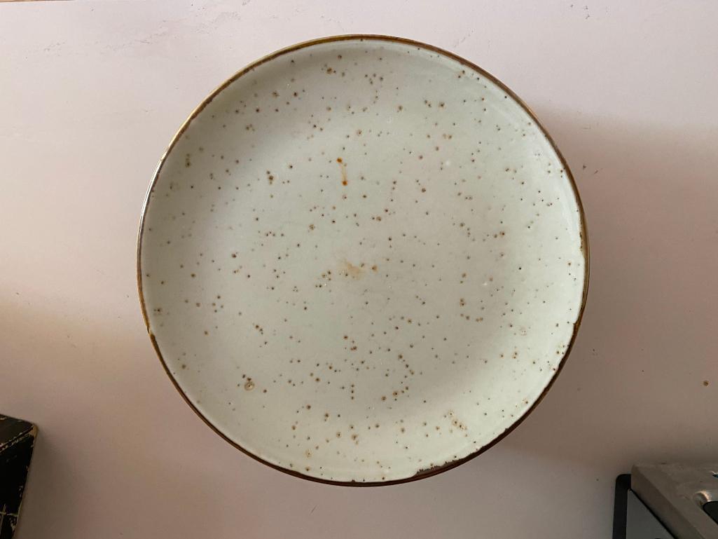 Eight Stoneware Side Plates