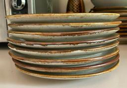 Eight Stoneware Side Plates