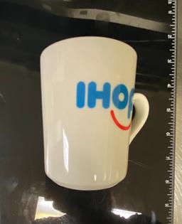 25 IHOP Coffee Cups in a Dishwasher Rack