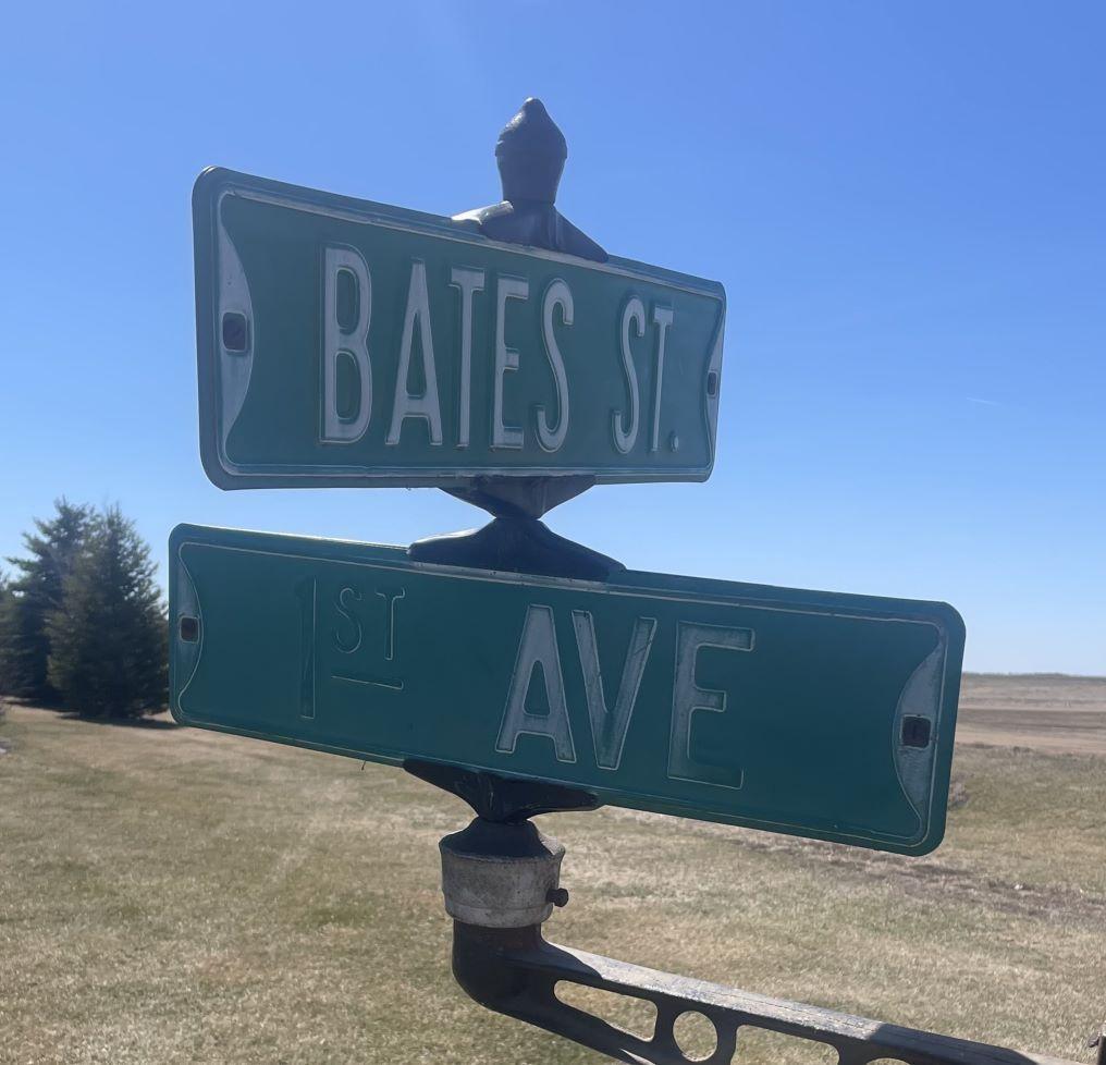 Flandreau, SD Embossed Street Signs w/ Cast Iron Holder (Bates St. & 1st Ave.)