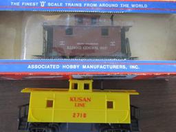 AHM 7306D Illinois Central Caboose and Kusan Line 2710 Caboose, O gauge