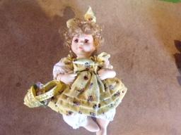 2 Porcelain Jointed Dolls McFIELD INTERNATIONAL CO.