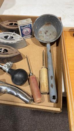 Box of antique irons,can spout,horn, ice picks