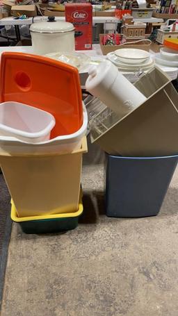 Lot of wastebaskets, shower caddy, toilet paper