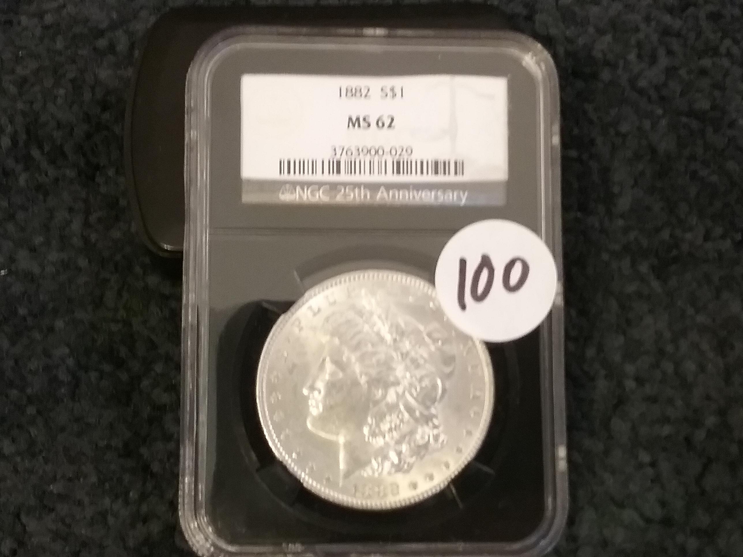 NGC 1882 Morgan Dollar in MS-62 in 25th Anniversary Black retro holder