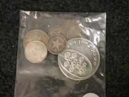 small bag of 90% silver foreign coins…approximately 1.7 ounces