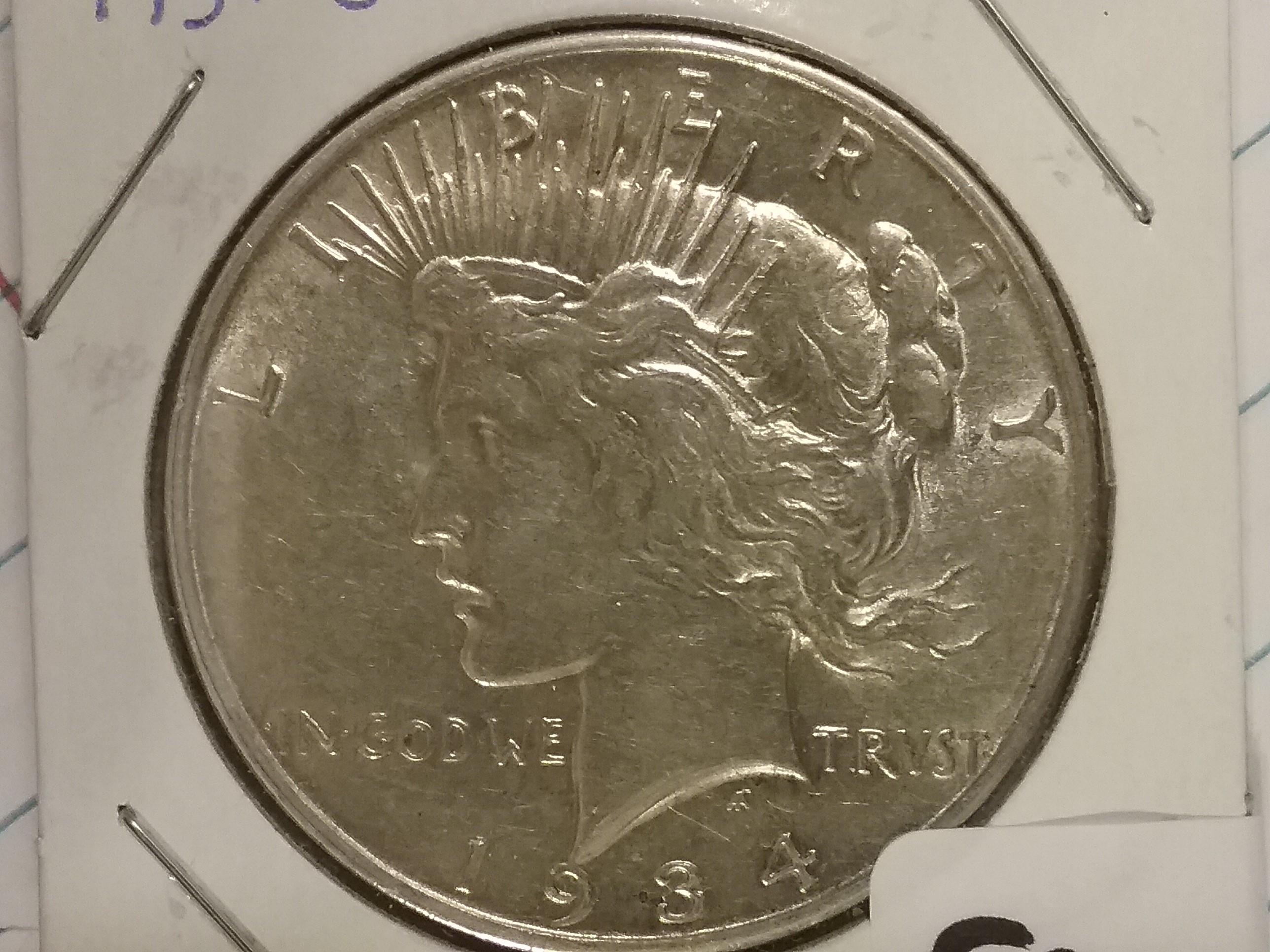 1934-D Peace Dollar in Au-55