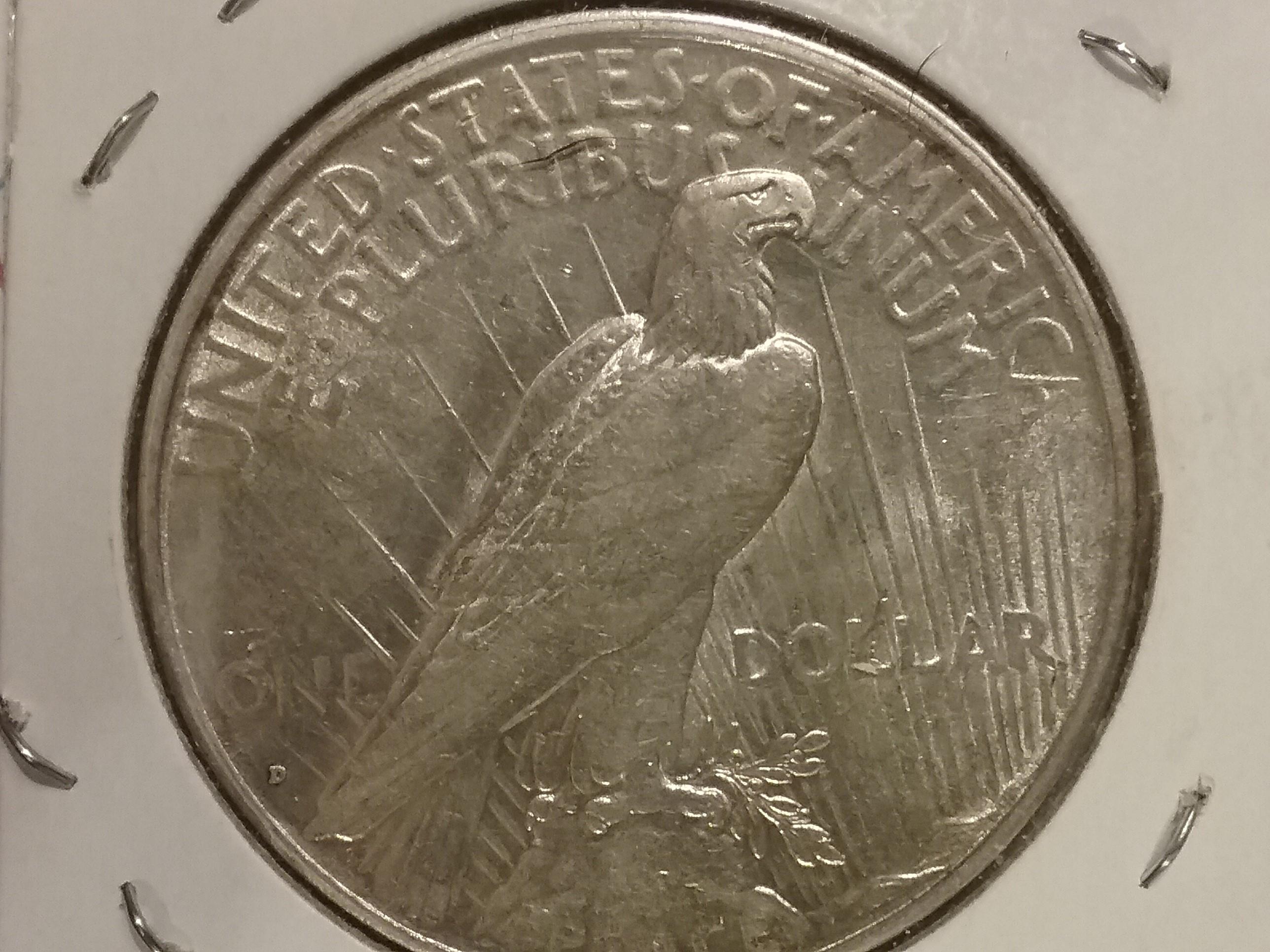 1934-D Peace Dollar in Au-55